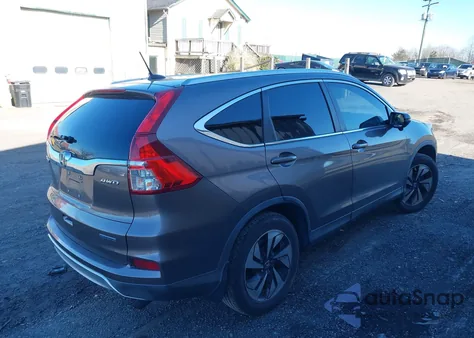 2015 Honda Cr-V Touring z USA, uszkodzony, nr VIN 5J6RM4H90FL090130